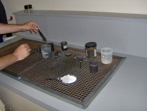 This is a down-draft table where they use various colors of powder to process fingerprints. The down-draft sucks up the excess powder, which would otherwise go everywhere.